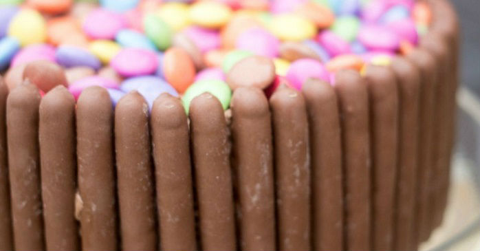 Smarties and chocolate fingers birthday cake