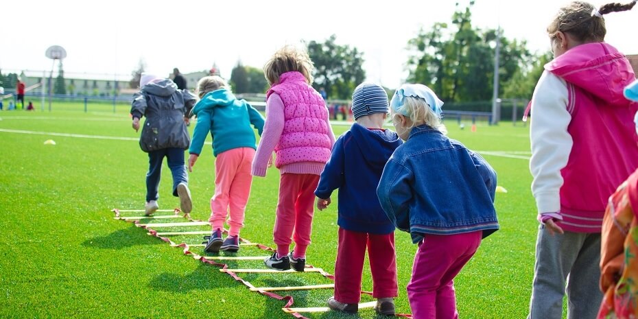 children outside playing a jumping game