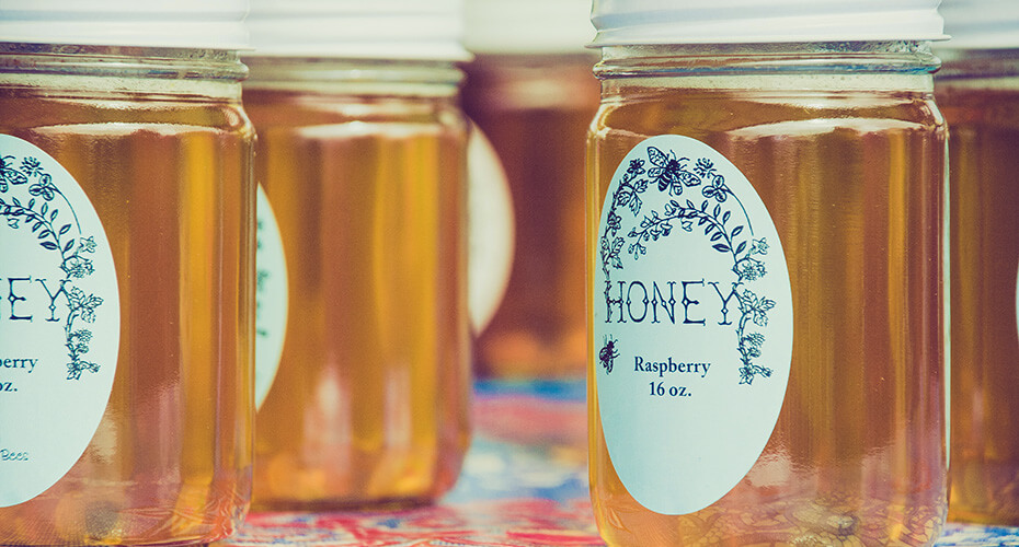 jars of honey with personalised labels
