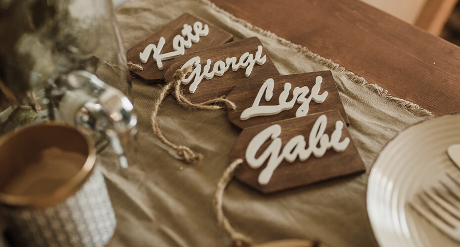 wooden craft name tags with white writing