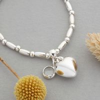 Silver plated Puffed heart bracelet with single crystal charm